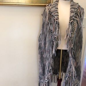 Long sleeveless sweater vest